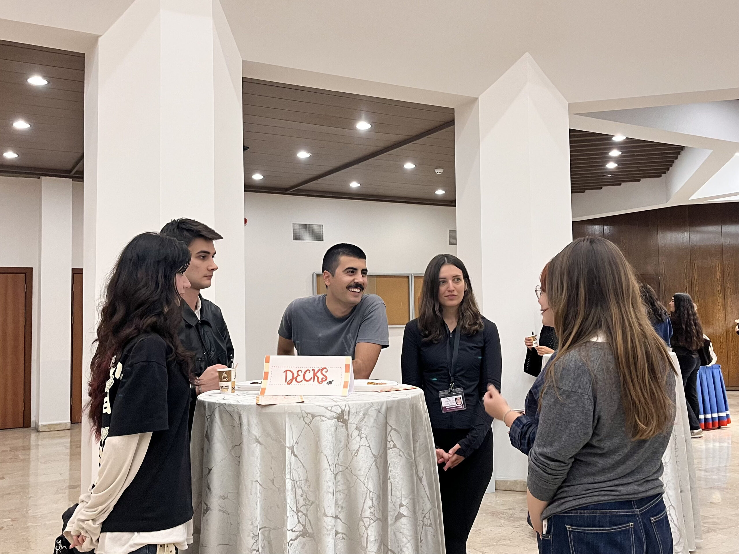 DeCKS Lab members talking with students at the lab table during the Bilkent Psychology Department Tea